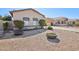 Charming home featuring xeriscaped yard and inviting curb appeal, complete with walkway stones at 4979 E Colonial Dr, Chandler, AZ 85249