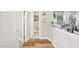 Hallway leading to a bathroom and sitting area, creating a cohesive flow at 4979 E Colonial Dr, Chandler, AZ 85249
