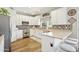 Stylish kitchen with white cabinets, stainless steel appliances, and attractive backsplash at 4979 E Colonial Dr, Chandler, AZ 85249
