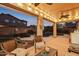 Covered patio with comfortable seating and ambient lighting, ideal for evening gatherings and relaxation at 4979 E Colonial Dr, Chandler, AZ 85249