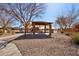 Community playground area with shaded picnic tables and playground equipment for outdoor fun at 4979 E Colonial Dr, Chandler, AZ 85249