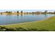 Scenic pond view with lush green surroundings in a tranquil neighborhood setting at 4979 E Colonial Dr, Chandler, AZ 85249