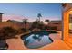 Twilight view of the private backyard pool highlighting the serene ambiance and lush landscaping at 4979 E Colonial Dr, Chandler, AZ 85249