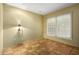 Bright bedroom with natural light, ceramic tile flooring, and a warm, inviting atmosphere at 5200 S Lakeshore Dr # 106, Tempe, AZ 85283