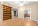 Bright and spacious living area with built-in shelving and an easy flow into the adjacent kitchen at 5200 S Lakeshore Dr # 106, Tempe, AZ 85283
