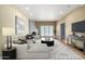Comfortable living room featuring a modern sofa, stylish decor, and a cozy fireplace at 5200 S Lakeshore Dr # 106, Tempe, AZ 85283