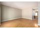 Bright living room with hardwood floors and a view into a bathroom vanity area at 5200 S Lakeshore Dr # 106, Tempe, AZ 85283