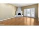 Spacious living room with a striking corner fireplace and bright sliding glass doors at 5200 S Lakeshore Dr # 106, Tempe, AZ 85283