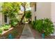 Lush community walkway amidst verdant trees, offering a tranquil and picturesque view of the property at 5200 S Lakeshore Dr # 106, Tempe, AZ 85283