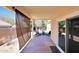 Covered patio with privacy screen, flagstone flooring, and outdoor seating at 6408 W Prickly Pear Trl, Phoenix, AZ 85083