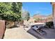 Desert landscaped backyard with mountain views, seating area and gravel ground cover at 6408 W Prickly Pear Trl, Phoenix, AZ 85083