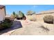 Large backyard featuring desert landscaping, rock accents, and block wall for privacy at 6408 W Prickly Pear Trl, Phoenix, AZ 85083
