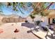 Desert backyard featuring gravel, landscaping, and patio with mountain views at 6408 W Prickly Pear Trl, Phoenix, AZ 85083