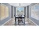Cozy dining room with natural light, a ceiling fan, and modern dining table at 6408 W Prickly Pear Trl, Phoenix, AZ 85083