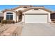 Charming single-story home showcasing desert landscaping and a two-car garage, perfect for a low-maintenance lifestyle at 6408 W Prickly Pear Trl, Phoenix, AZ 85083