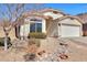 A well-maintained single-story home displays a tidy front yard with desert landscaping and a two-car garage at 6408 W Prickly Pear Trl, Phoenix, AZ 85083