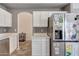 Spacious kitchen with stainless steel refrigerator and countertops with barstool seating at 6408 W Prickly Pear Trl, Phoenix, AZ 85083
