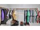This walk-in closet includes rods, shelves, and shoe racks for ample storage space at 6408 W Prickly Pear Trl, Phoenix, AZ 85083
