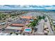 The aerial view of the recreation center showcases the pool, common areas, and shuffleboard courts at 650 N Hawes Rd # 2873, Mesa, AZ 85207