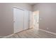 Bedroom with sliding closet doors leading to bathroom at 650 N Hawes Rd # 2873, Mesa, AZ 85207