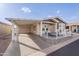 Charming home with a covered carport and cozy front porch, perfect for relaxing at 650 N Hawes Rd # 2873, Mesa, AZ 85207