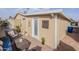 The home's exterior has a cozy patio area with wicker furniture at 650 N Hawes Rd # 2873, Mesa, AZ 85207