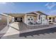 Inviting home featuring a covered carport and a charming patio area for outdoor enjoyment at 650 N Hawes Rd # 2873, Mesa, AZ 85207