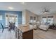 Inviting living room featuring an open floor plan to the kitchen and dinette area at 650 N Hawes Rd # 2873, Mesa, AZ 85207
