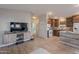 Inviting living room with tiled floors, a media center, flowing into the kitchen for seamless entertaining at 650 N Hawes Rd # 2873, Mesa, AZ 85207