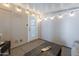 Enclosed patio featuring string lights, epoxy flooring, and comfortable seating area at 650 N Hawes Rd # 2873, Mesa, AZ 85207