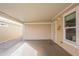 Covered carport area with a roll up door and security gate for convenience and privacy at 650 N Hawes Rd # 2873, Mesa, AZ 85207