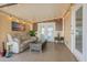 Cozy sunroom with comfortable seating, perfect for relaxing and enjoying natural light at 650 N Hawes Rd # 2873, Mesa, AZ 85207