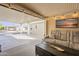 Bright sunroom leading to a covered parking area, combining indoor comfort with outdoor access at 650 N Hawes Rd # 2873, Mesa, AZ 85207