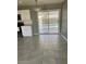 A kitchen view reveals a sliding door leading to the outside pool, complemented by tiled floors at 6607 W Osborn Rd, Phoenix, AZ 85033