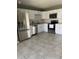 The kitchen is equipped with stainless steel appliances, white cabinets, and subway tile backsplash at 6607 W Osborn Rd, Phoenix, AZ 85033