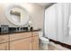 Charming bathroom featuring granite countertop, round mirror and shower with curtain at 6803 E Main St # 3306, Scottsdale, AZ 85251
