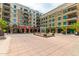 Landscaped courtyard featuring a decorative water fountain, mature trees, and architectural details at 6803 E Main St # 3306, Scottsdale, AZ 85251