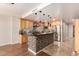 This kitchen has wooden cabinets, stainless appliances and a tile kitchen island with pendant lighting overhead at 6803 E Main St # 3306, Scottsdale, AZ 85251