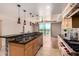 Eat at the bar in this kitchen which features stainless appliances and an undermount sink at 6803 E Main St # 3306, Scottsdale, AZ 85251