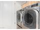 Laundry room featuring stainless steel, front load washer and dryer units at 6803 E Main St # 3306, Scottsdale, AZ 85251