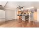 Bright living room and kitchen with wood floors, a ceiling fan, stainless appliances and a tile kitchen island at 6803 E Main St # 3306, Scottsdale, AZ 85251