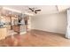 Spacious living room with hardwood-style floors and a view of the modern kitchen at 6803 E Main St # 3306, Scottsdale, AZ 85251