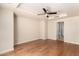 Spacious main bedroom with hardwood floors and ceiling fan at 6803 E Main St # 3306, Scottsdale, AZ 85251