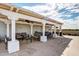 Relaxing patio area with comfortable seating under a pergola, ideal for gatherings and outdoor relaxation at 6803 E Main St # 3306, Scottsdale, AZ 85251