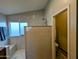 New shower room with a small window, shower head, and a tile seat at 6901 W Marco Polo Rd, Glendale, AZ 85308