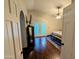 Bedroom featuring hardwood floors, a ceiling fan, a TV, and access to a large patio at 6901 W Marco Polo Rd, Glendale, AZ 85308