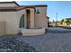 Angle view of the home's exterior with a circular bay window and desert landscaping at 6901 W Marco Polo Rd, Glendale, AZ 85308