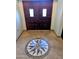 Entrance foyer features a decorative mosaic and beautiful double doors with a tile floor at 6901 W Marco Polo Rd, Glendale, AZ 85308