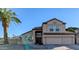 Charming two-story home with a well-manicured yard, a grand entrance and a three car garage at 6901 W Marco Polo Rd, Glendale, AZ 85308
