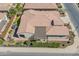 Aerial view of the home featuring outdoor living spaces: a patio, green turf, well-maintained landscaping at 706 E La Palta St, Queen Creek, AZ 85140
